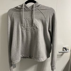 bench slightly cropped gray sweater